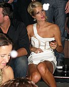 Paris Hilton's upskirt photos showing her panties while sitting down in a club in these pics